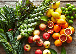 a group of fruits and vegetables on a wood surface Healthy Weight Loss Diets Halstead