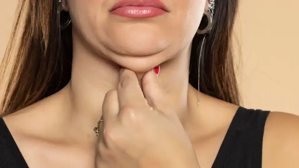 An image of a woman with double chin, sad, worried : Non Surgical Double Chin Removal Treatment in Halstead, UK
